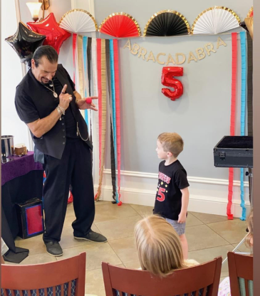 hire-party-magician-south-florida-red-and-black-e1739123340620